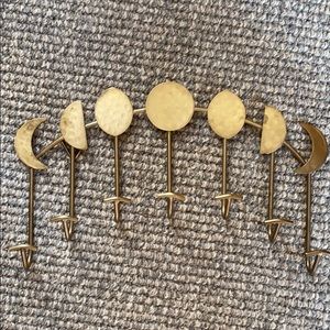 Moon phase gold wall hanger.